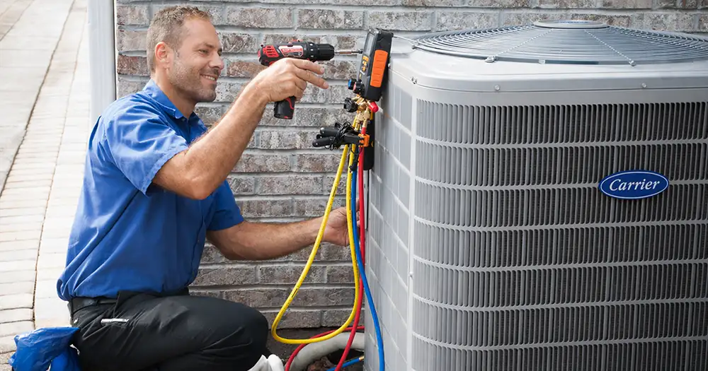 HVAC tech working on an outdoor AC unit