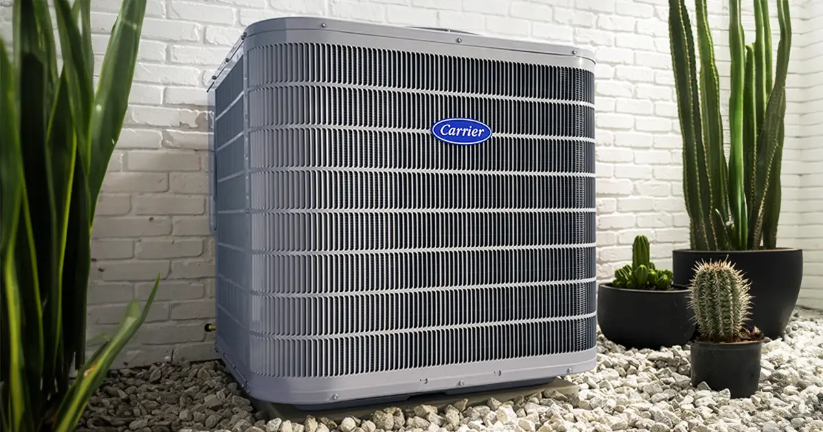ac unit between plants and against white brick wall