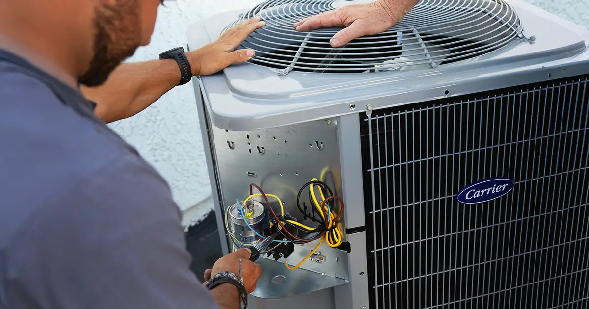 technician working on an AC unit