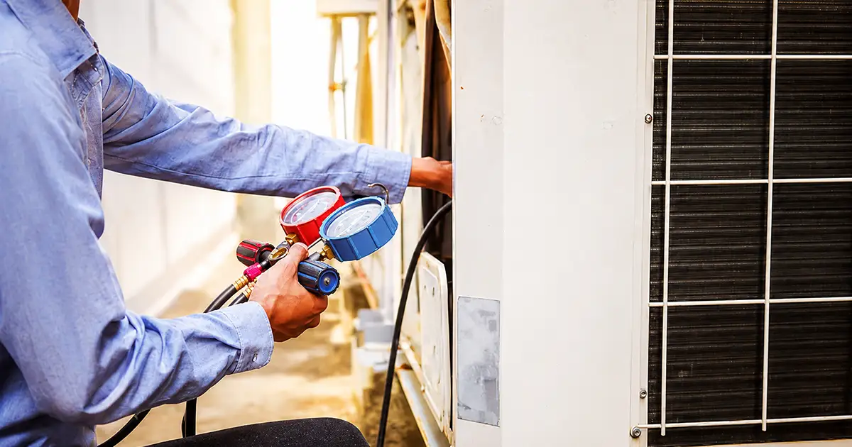 technician working on an AC unit