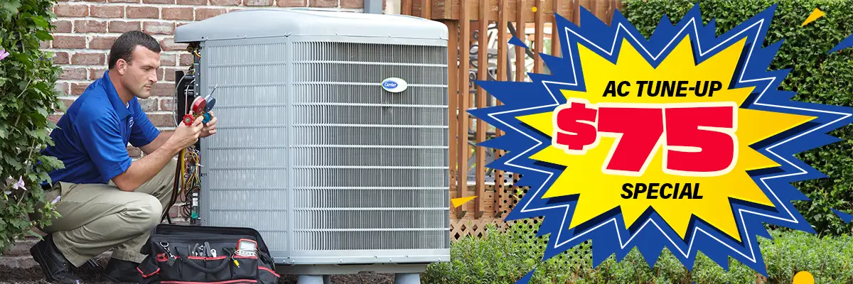 An HVAC technician servicing a Carrier outdoor AC unit, next to a large starburst graphic that reads "AC TUNE-UP $75 SPECIAL."