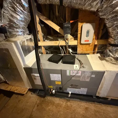 New air handler in Jacksonville, Florida home attic. Caption reads "AFTER."