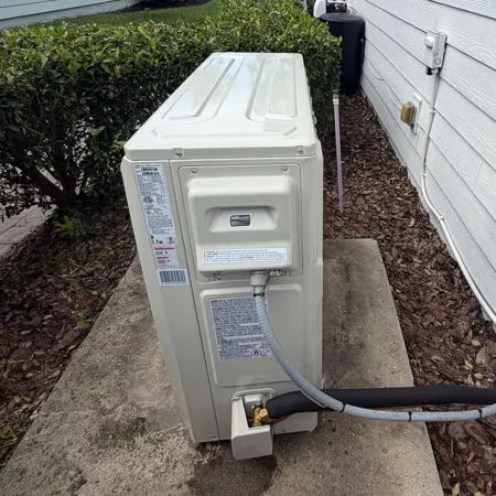 New outdoor AC unit in Jacksonville, Florida. Caption reads "AFTER."