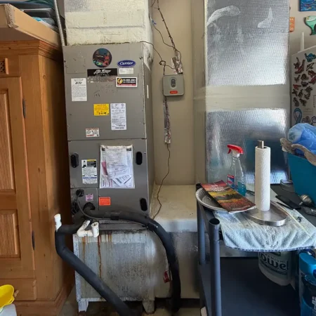 Old air handler in Jacksonville, Florida home. Caption reads "BEFORE."