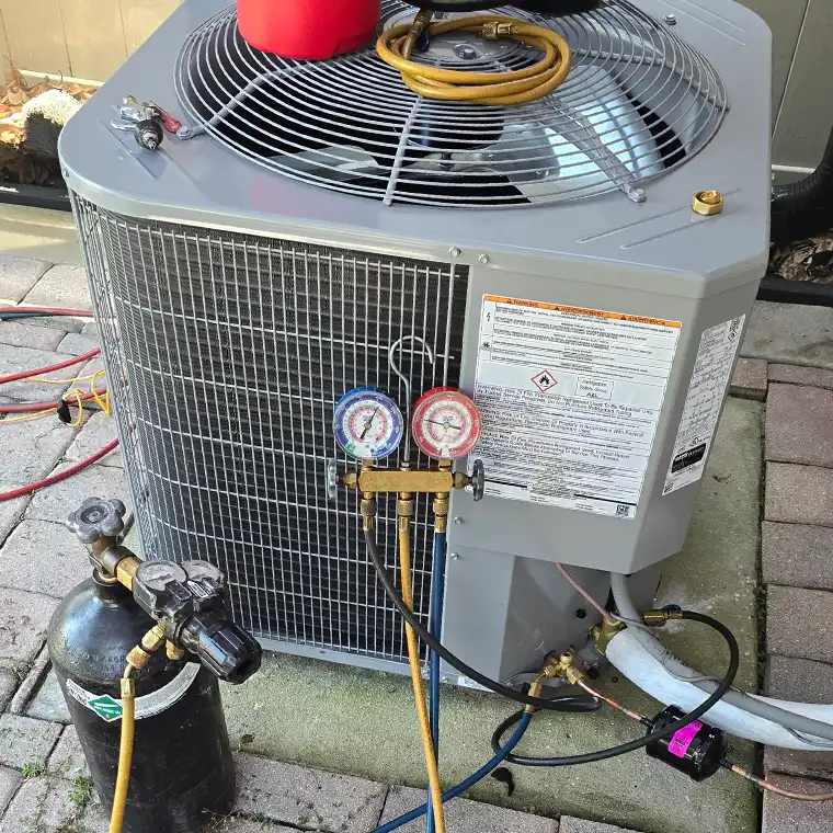 AC repair service on an outdoor condenser unit using manifold pressure gauges and equipment in Orlando, Florida.