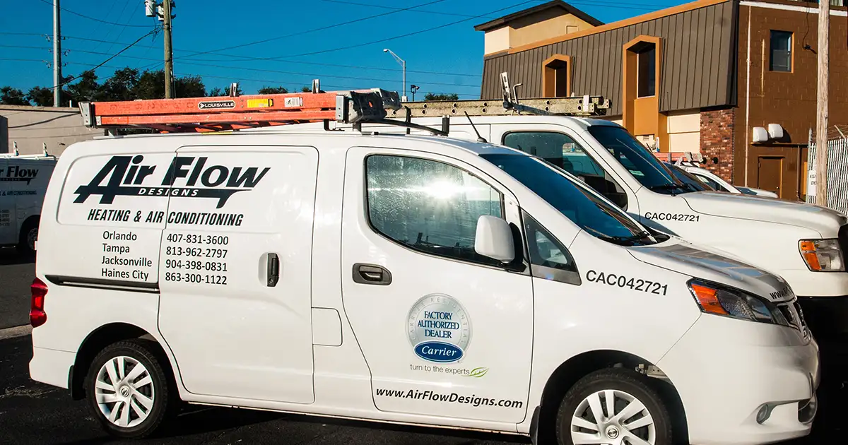 Air Flow Designs branded vans parked outside of their Orlando/Casselberry location.