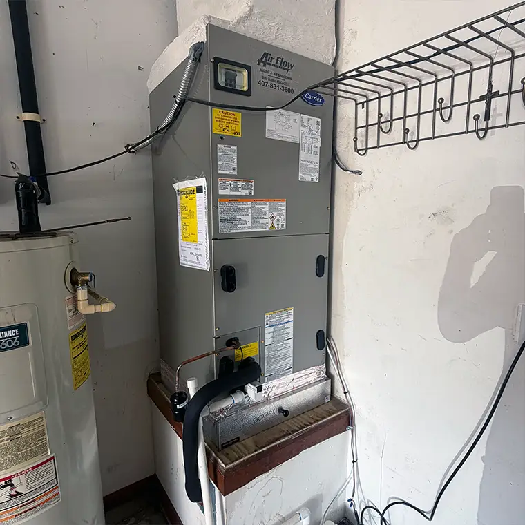 Carrier indoor air handler installed in a garage during an AC installation in Jacksonville.