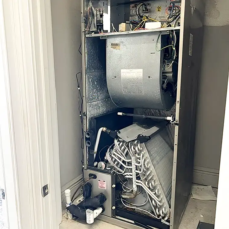 Indoor air handler opened for inspection and AC repair in Jacksonville.