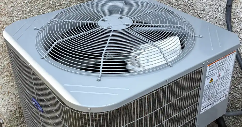 Carrier outdoor AC condenser installed during an AC replacement in Jacksonville.