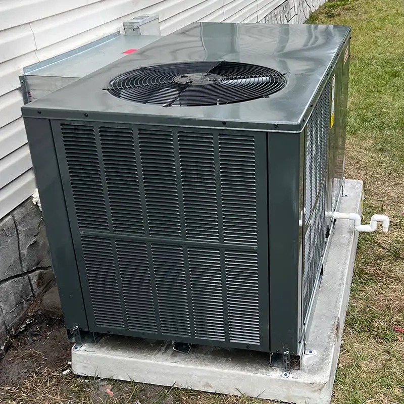 New outdoor HVAC unit installed on a concrete pad after an AC replacement in Orlando.