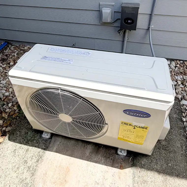 Carrier outdoor AC unit installed beside a home in Jacksonville.